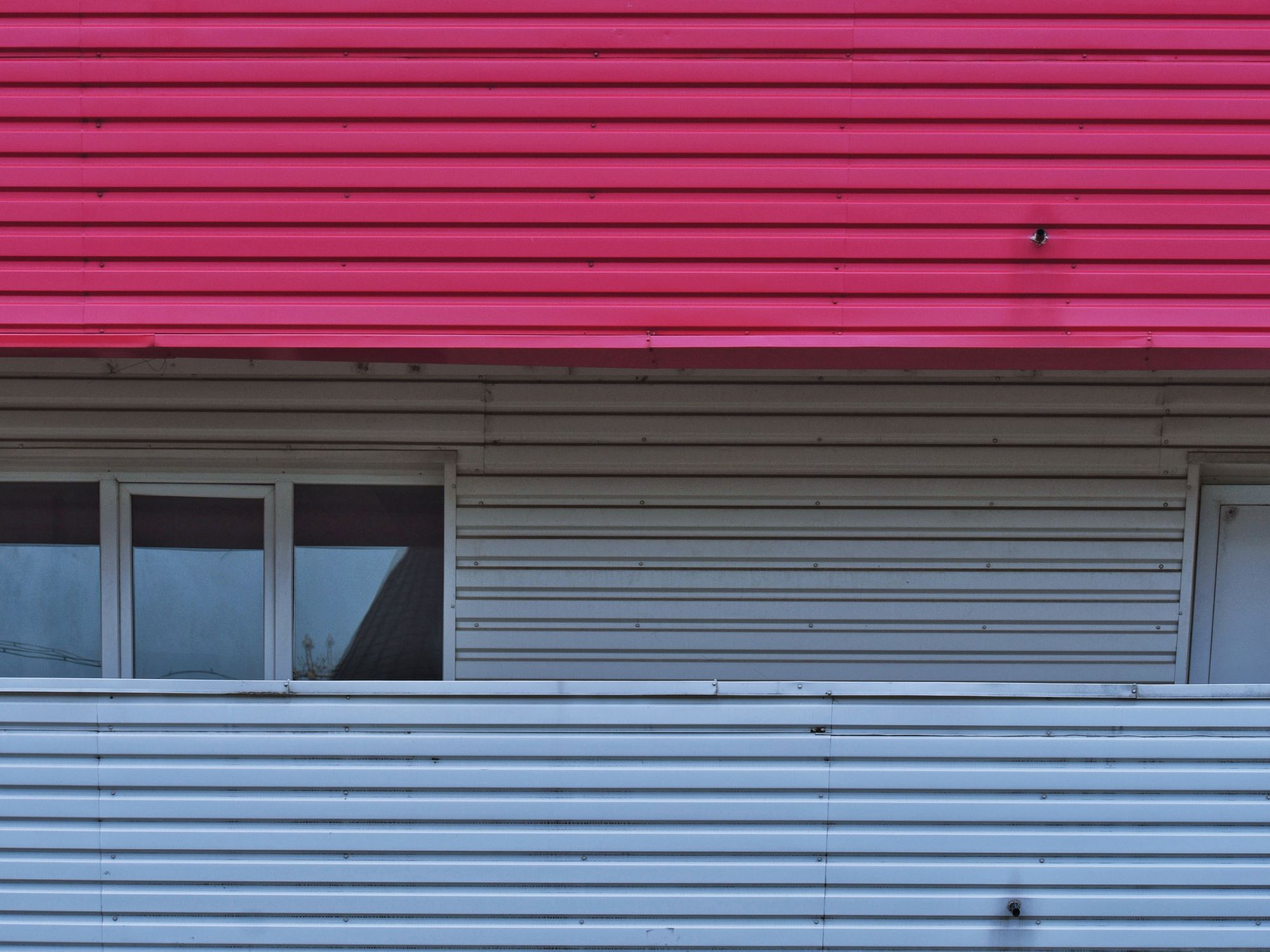 Exterior Painting in Brent Cross, Barnet — painter refreshing a house exterior in weatherproof paint