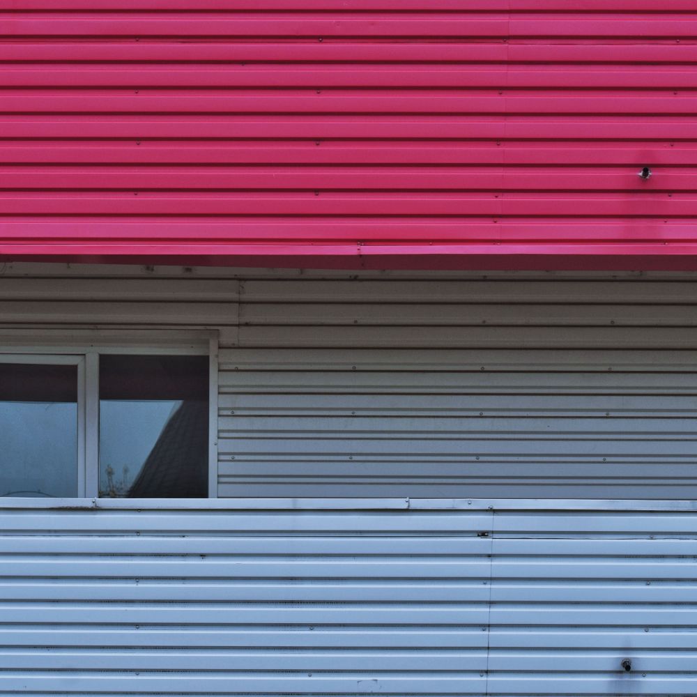 Exterior Painting in St Helier — walls rolled to an even, flat finish