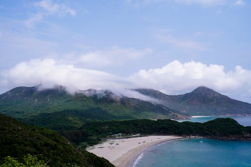 Free A view of a beach and mountains from a hill Stock Photo