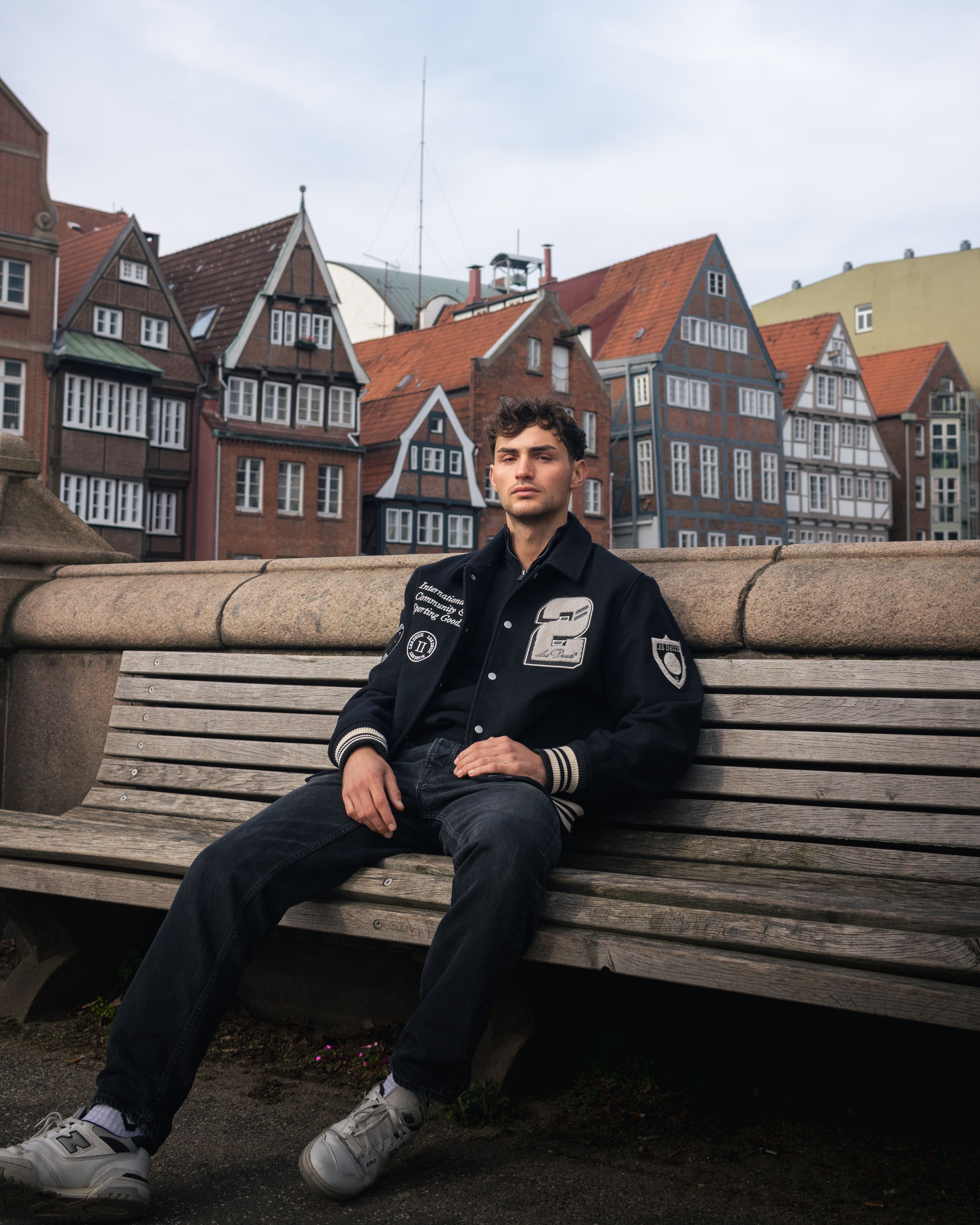 Man in Black Jacket Sitting on Bench · Free Stock Photo