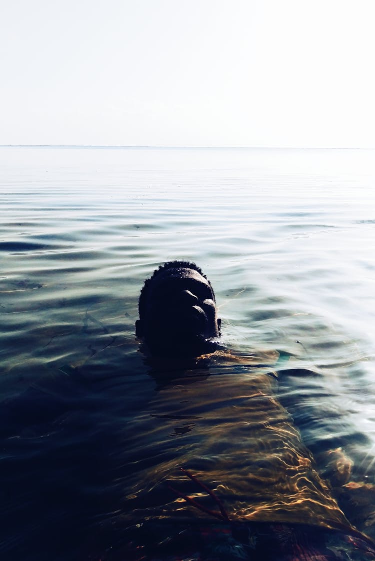 Photo Of Man Floating On Water