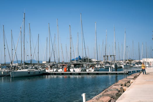 Scenic view of luxury yachts anchored at the marina in Foça, İzmir, Türkiye on a clear day.