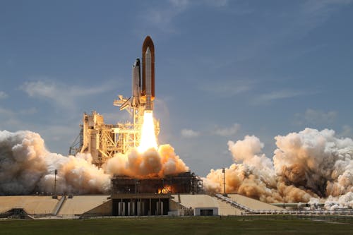 Free Time Lapse Photography of Taking-off Rocket Stock Photo