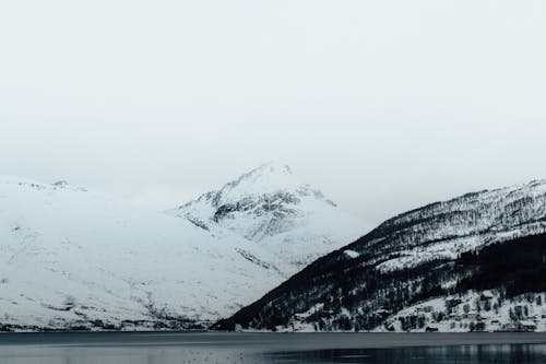 A black and white photo of a snowy mountain