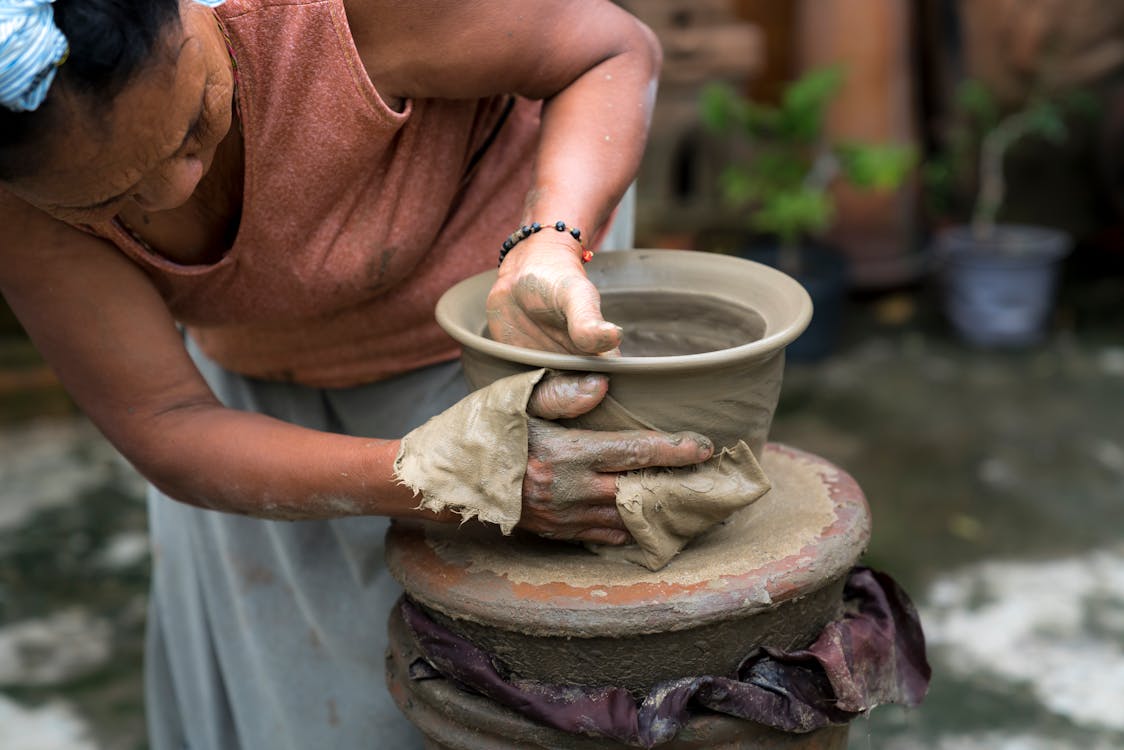 Free Woman Making Clay Jar Stock Photo