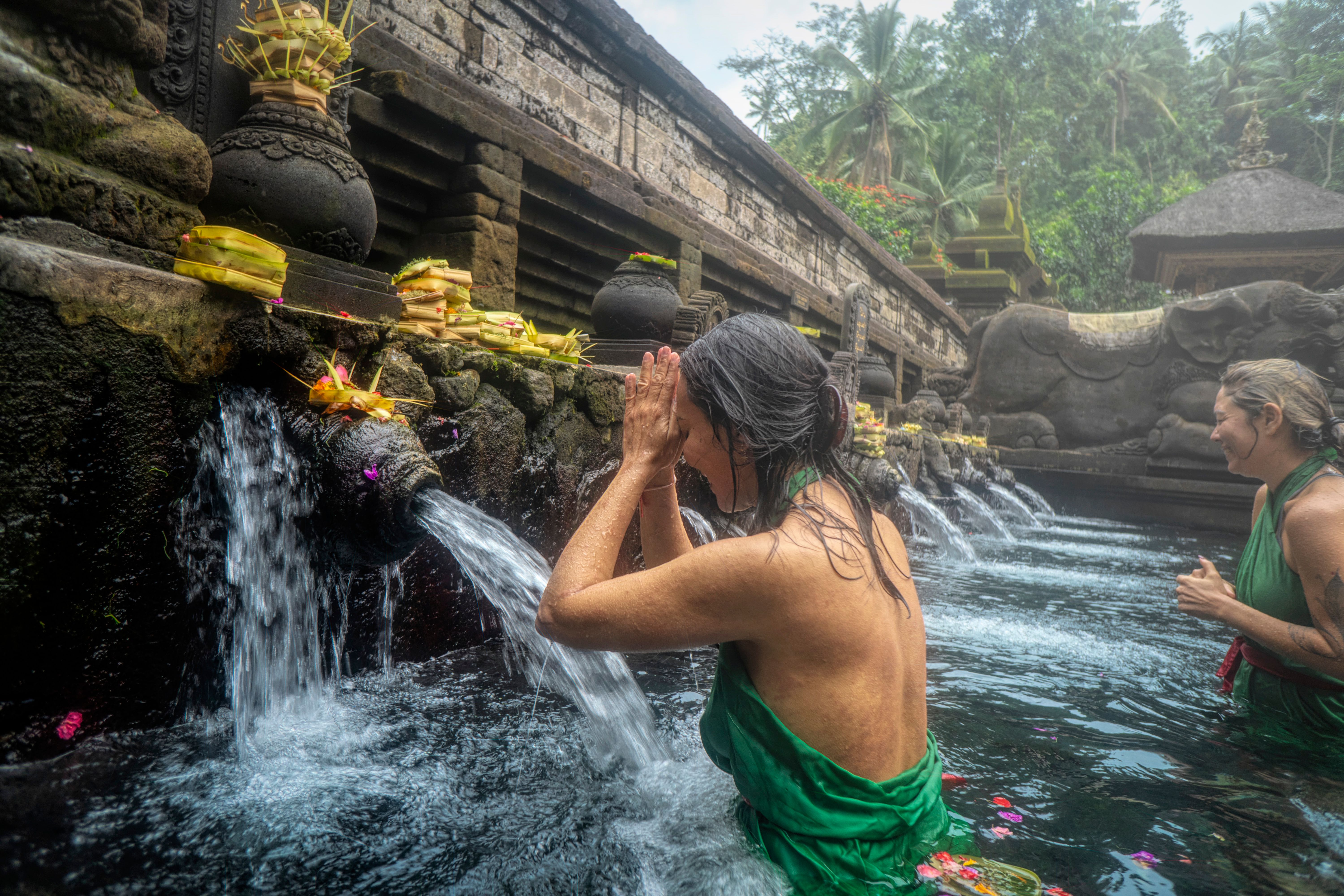 Woman Standing in Front of Flowing Water · Free Stock Photo