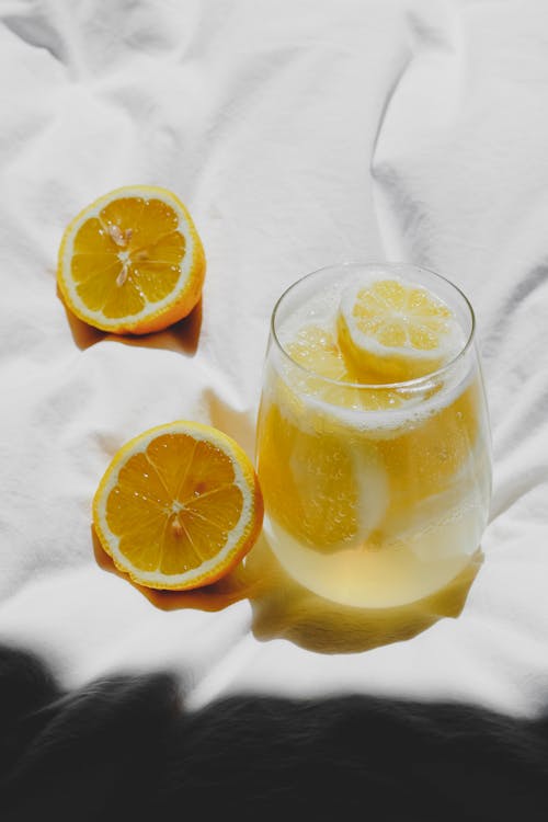 Free A glass of lemonade with slices of lemon on top Stock Photo