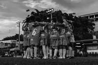 Back View of Boys Standing Together in Soccer Game