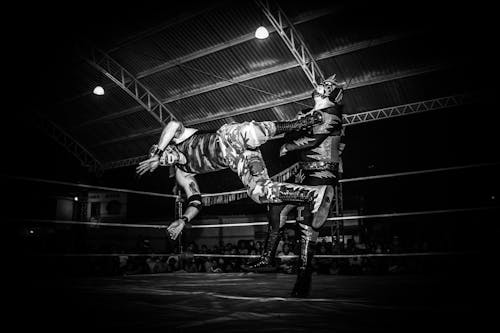 Free Grayscale Photography of Wrestler on Field Stock Photo