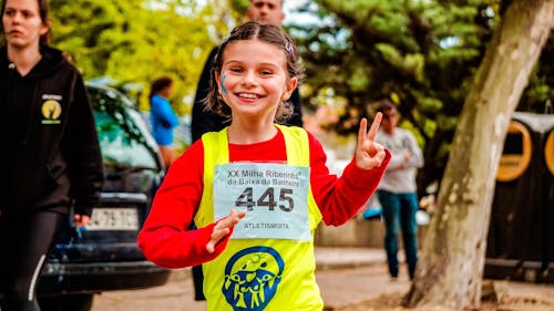 Girl Wearing Red and Yellow Top Running