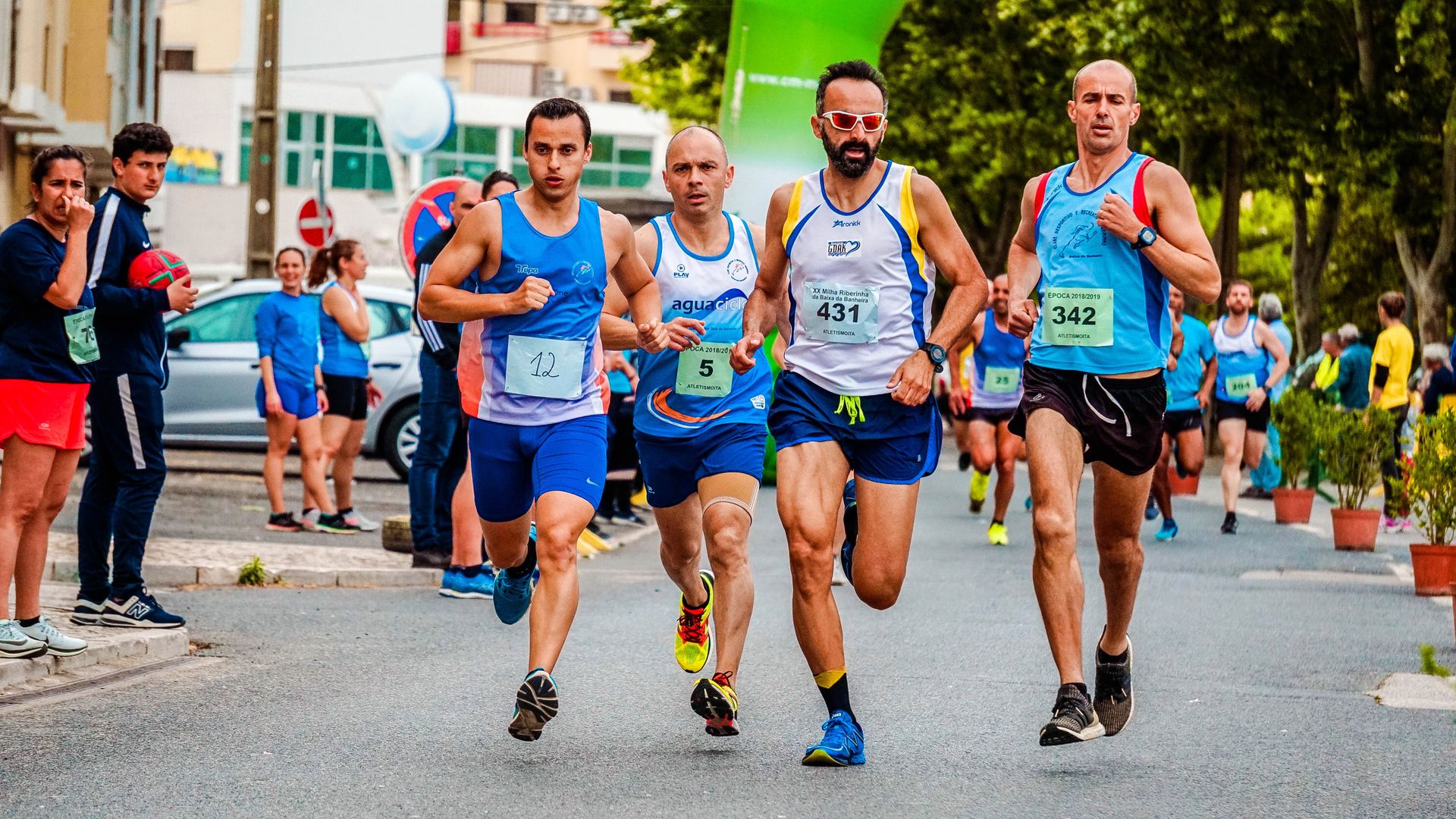 Runners surging off the line of a road race