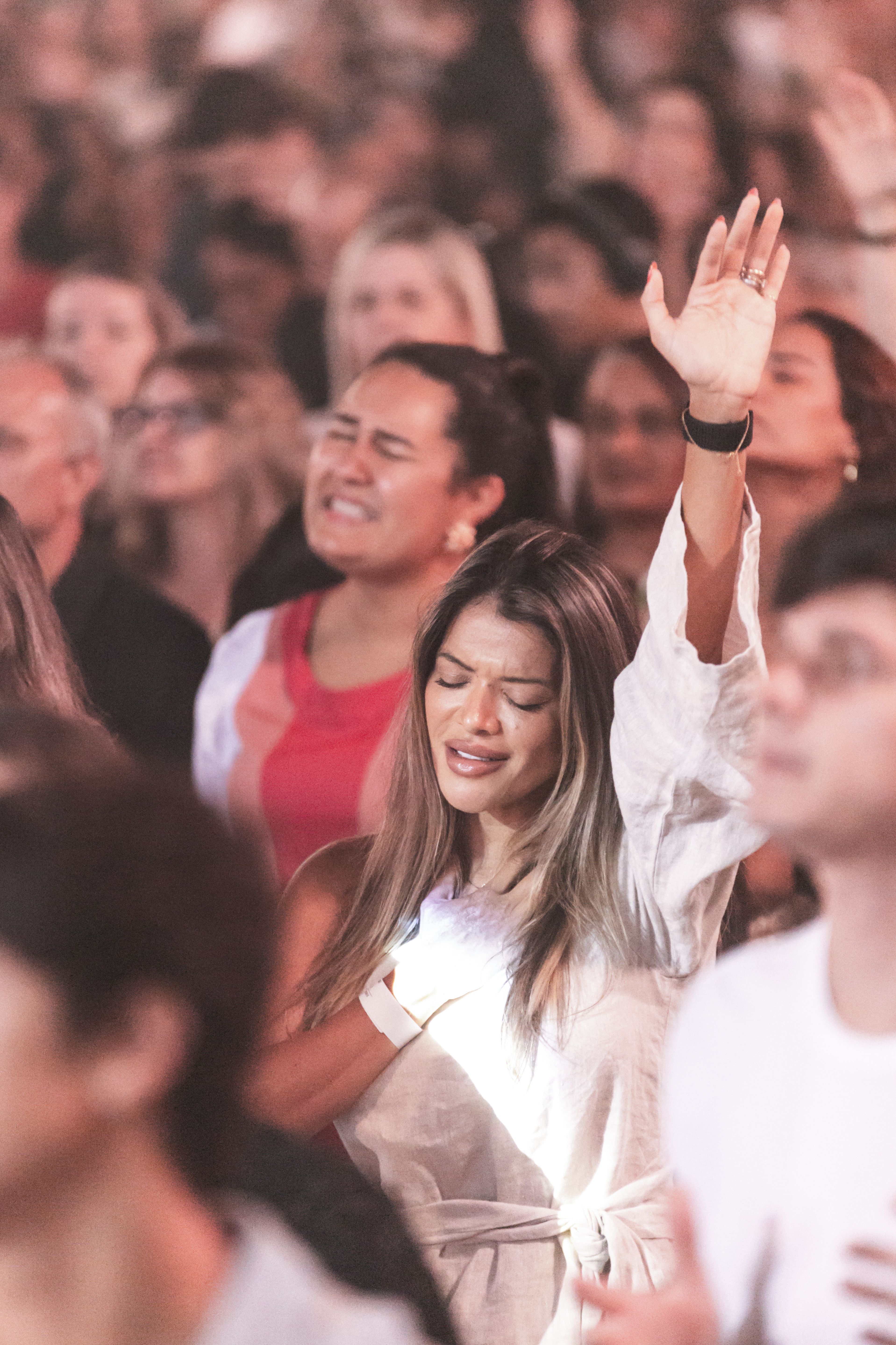 audience singing along at concert night