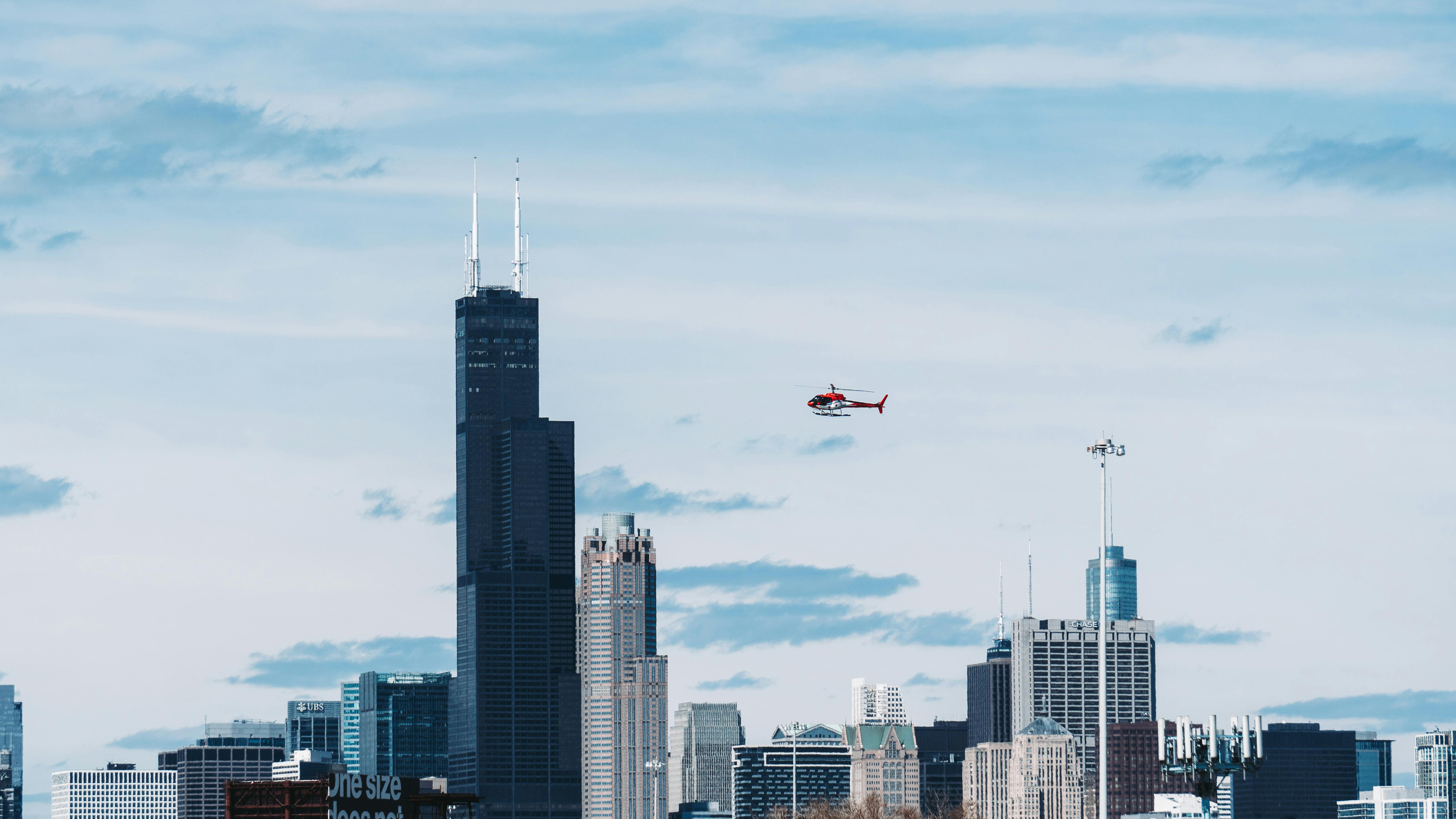 Helicopter Above Buildings · Free Stock Photo