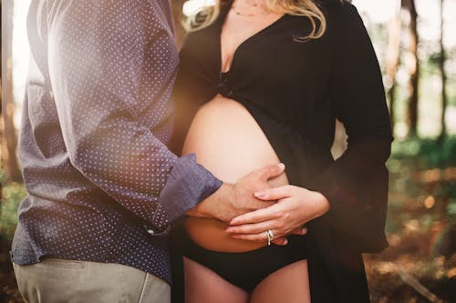 Man Touching Woman's Baby Bump