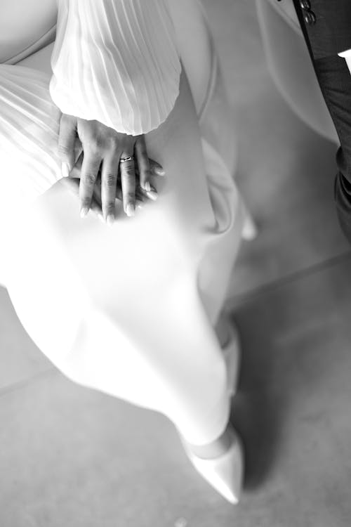 A black and white photo of a woman's hands