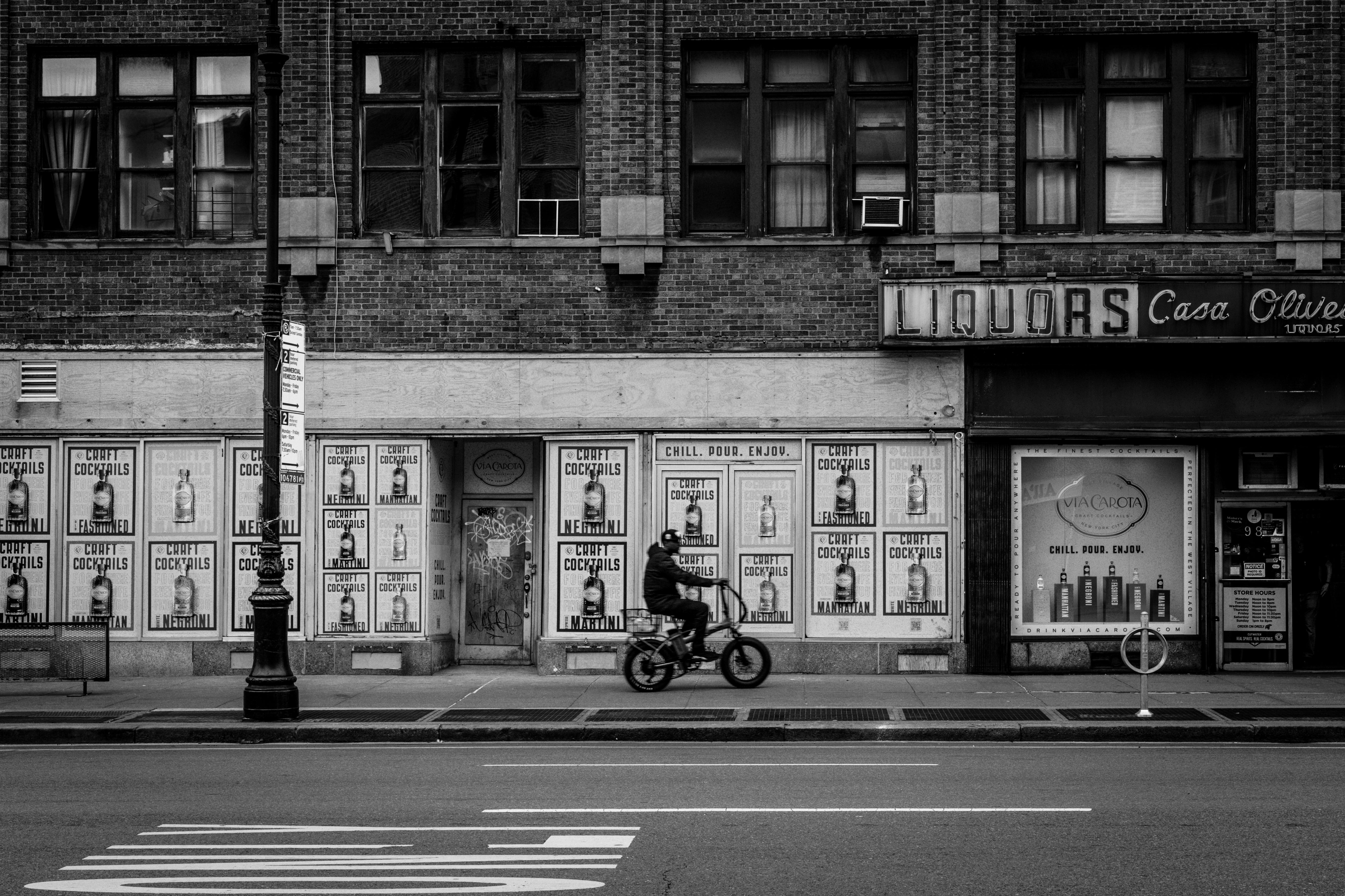 man on bicycle on sidewalk