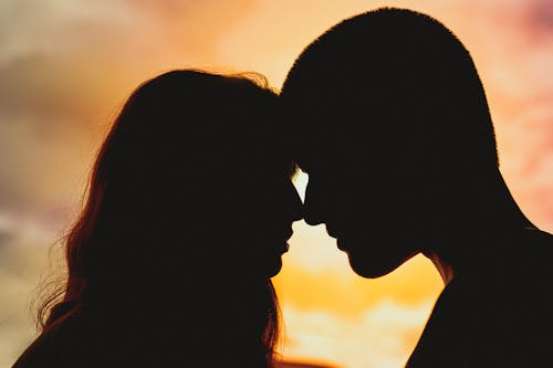 Man and Woman Near Grass Field · Free Stock Photo