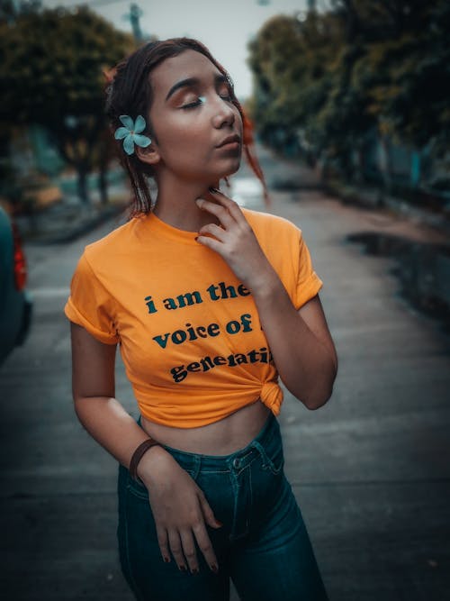 Free Standing Girl Wearing Orange and Black Crew-neck T-shirt Stock Photo