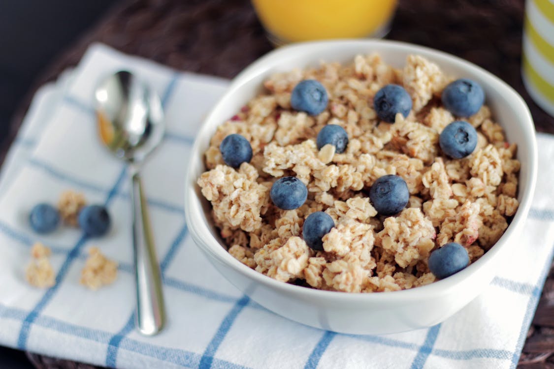 Free Bowl of Cooked Foods Beside Spoon Stock Photo