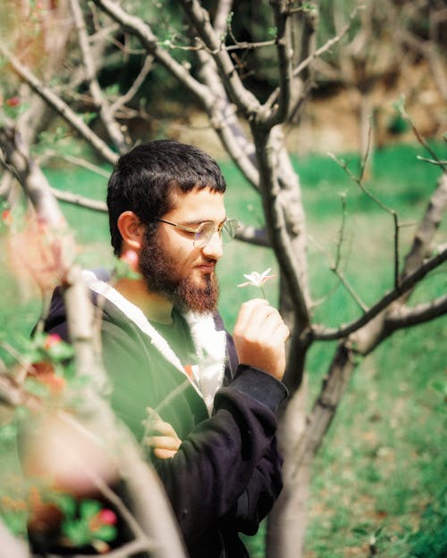 Portrait of Man Holding Flower