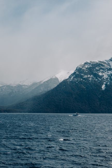 Scenic view of snow-capped mountains and lake in San Carlos de Bariloche, Argentina.