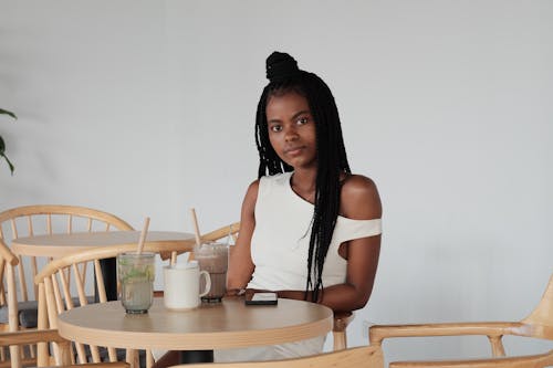 A woman sitting at a table in a cafe