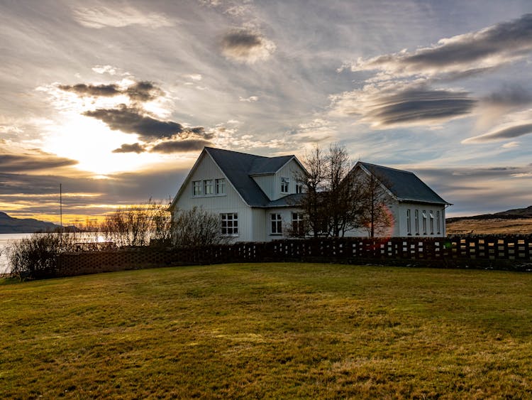 House Building By The Lake During Sunset 