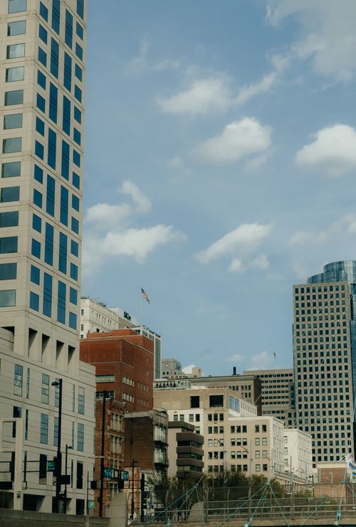 Free Downtown Cincinnati buildings against a blue sky, showcasing urban architecture. Stock Photo