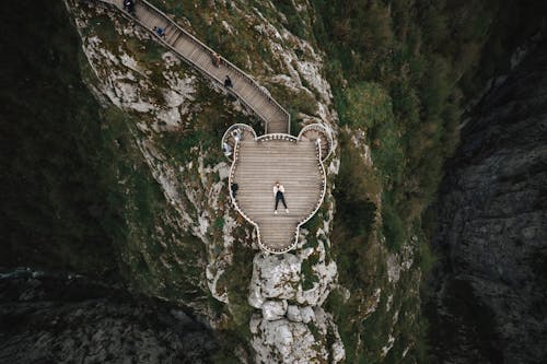 Person Lying Down on Terrace in Mountains