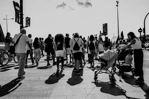 Free Captivating black and white photo of pedestrians walking a busy street in Valencia, Spain. Stock Photo