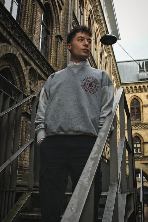 Man in Pullover on Stairs