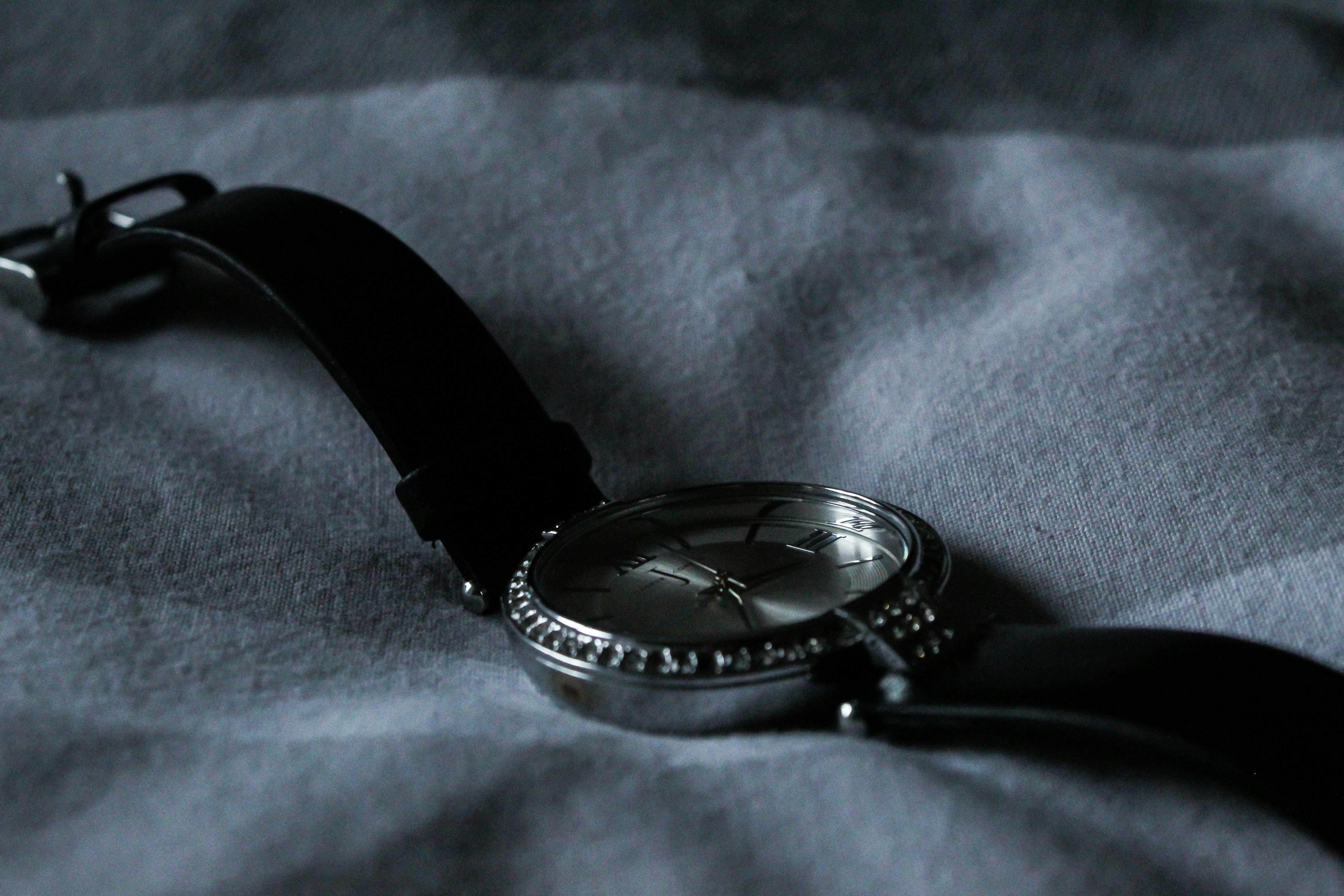 Grey Watch on Grey Textile · Free Stock Photo