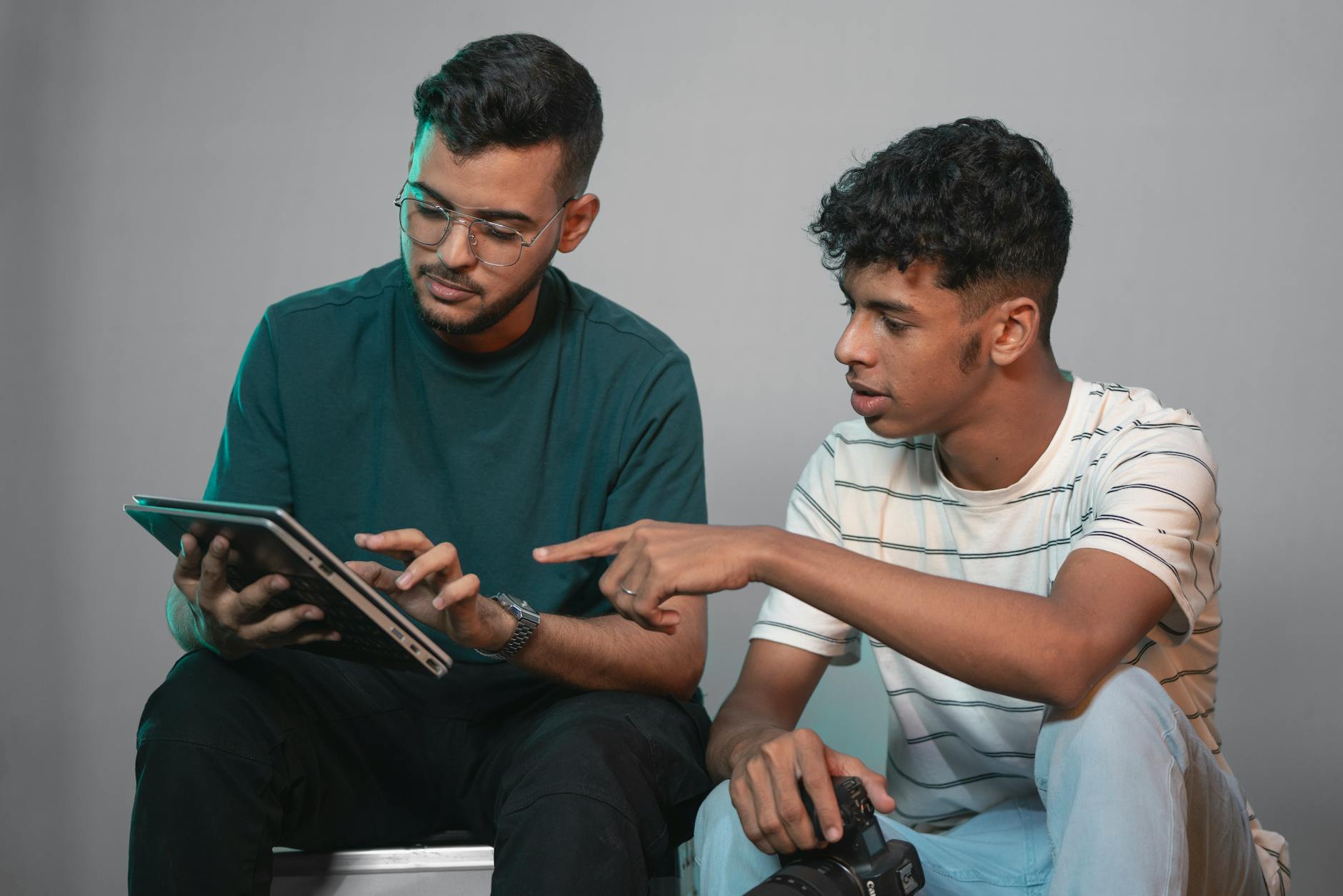 Men Sitting with Tablet