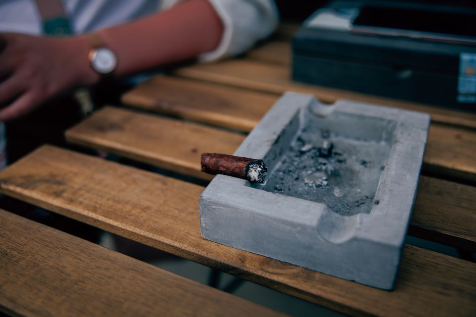 Proper cigar ash control and gentle ashing technique Proper cigar ash control and gentle ashing technique