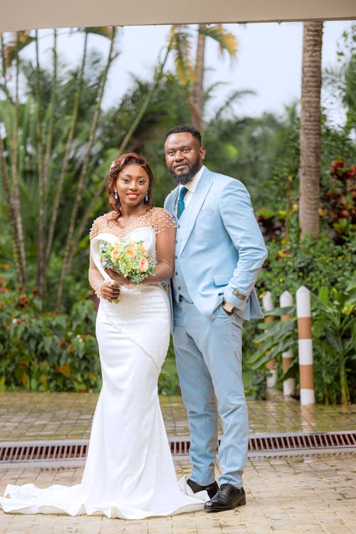 Bride and Groom Standing in a Park 