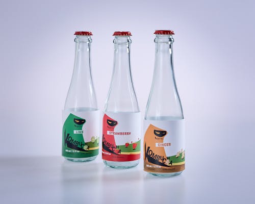 Three bottles of water with different designs