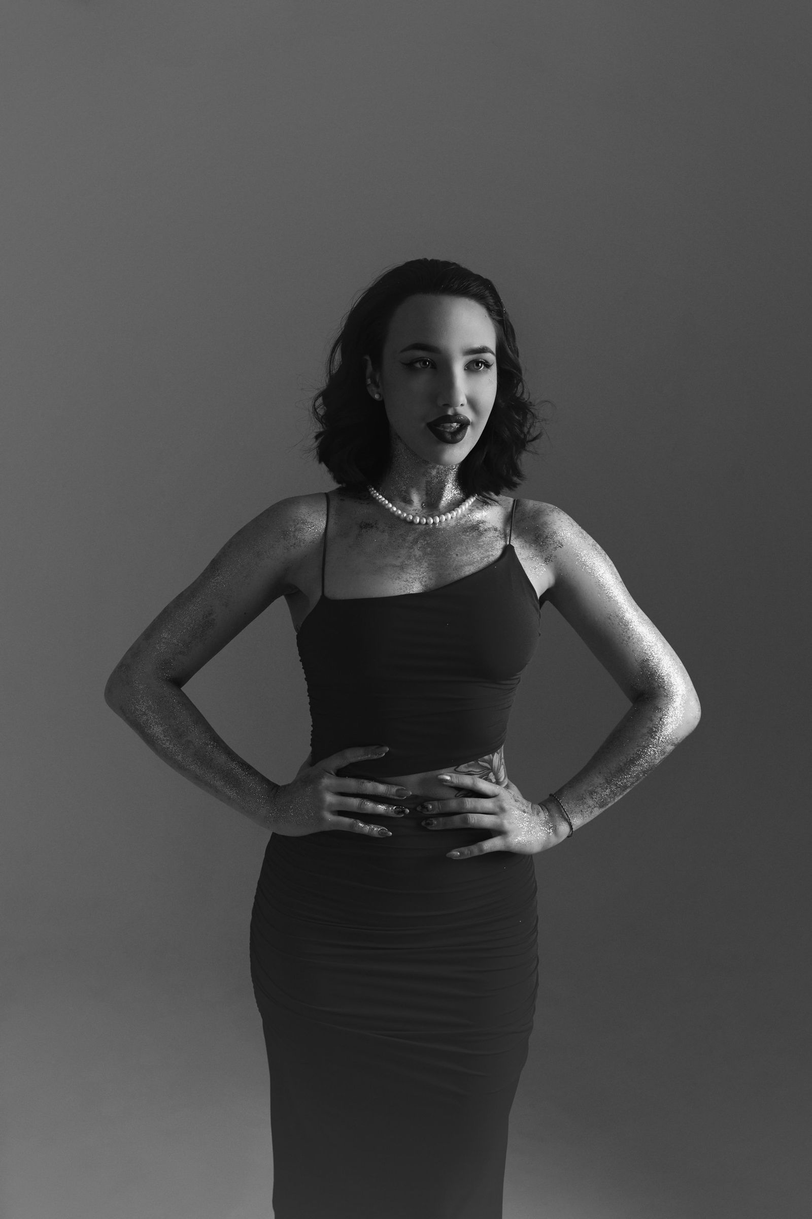 elegant woman in lace co-ord set monochrome editorial portrait