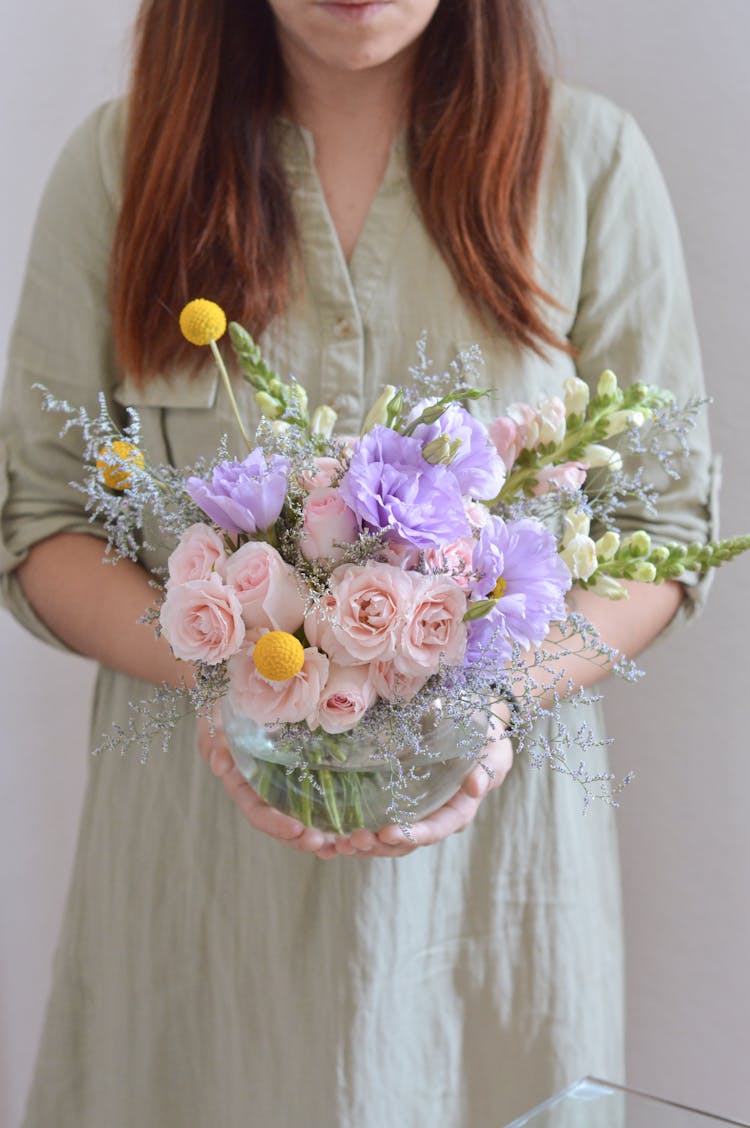 Woman In Dress Holding Roses Bouquet