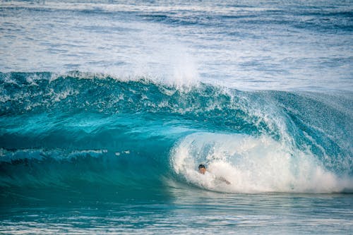 A surfer riding a wave in the ocean