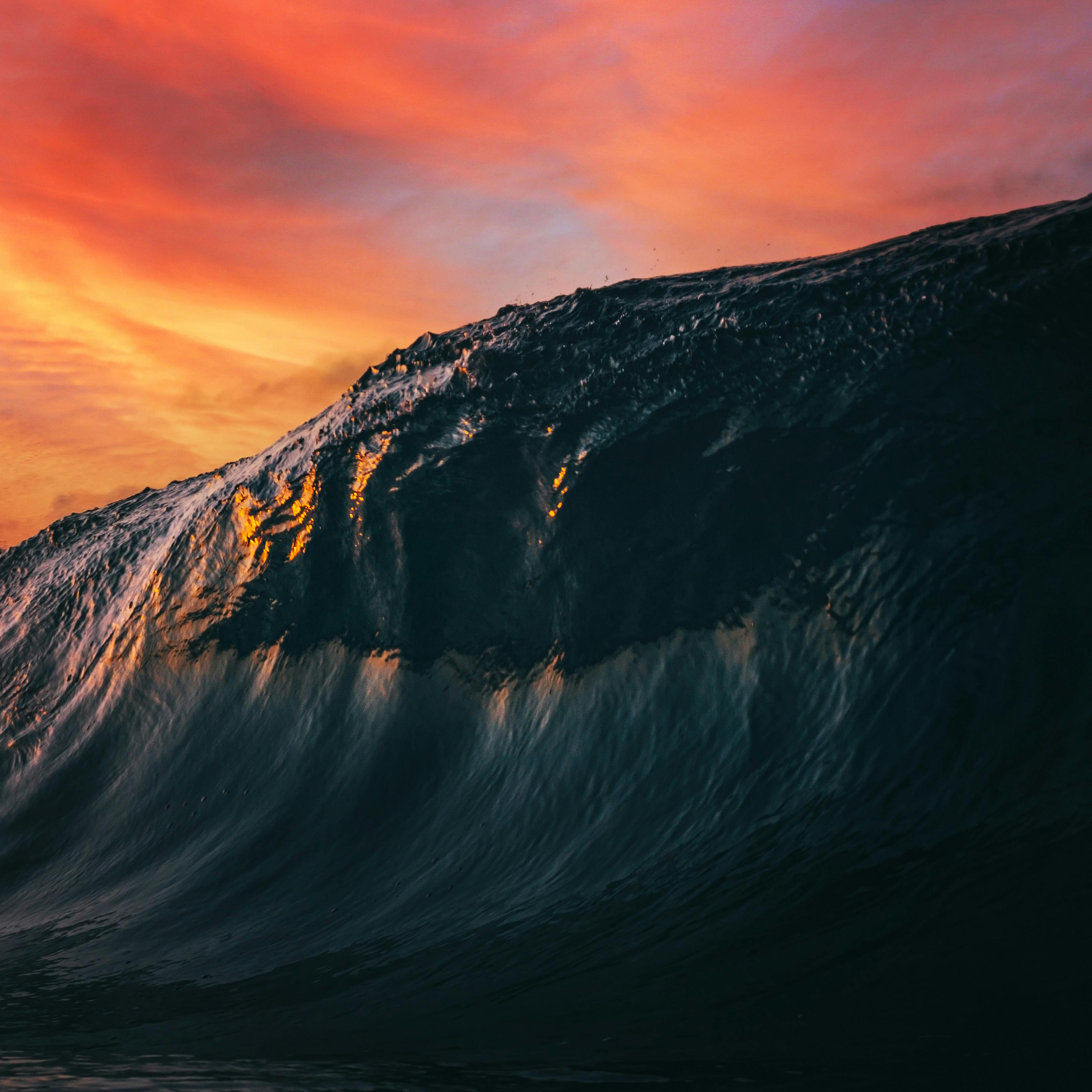 huge wave on sea at sunset