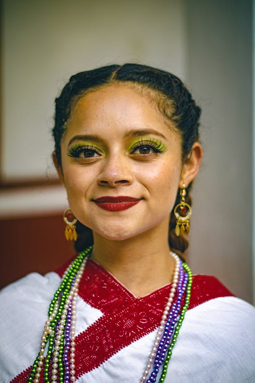 Free A woman in traditional clothing with beads and jewelry Stock Photo