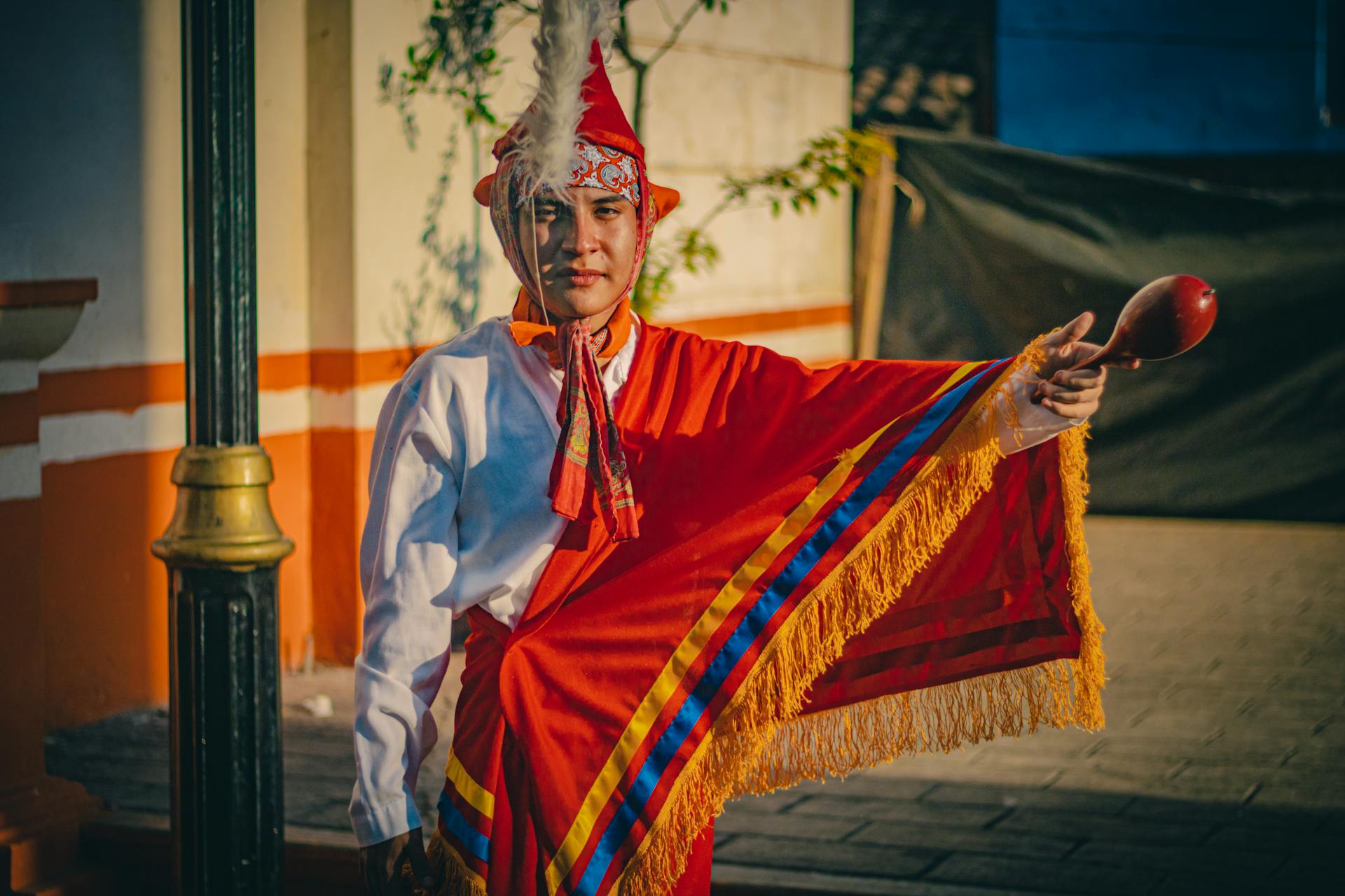 A Quetzal Dancer in Traditional Clothing at a Festival