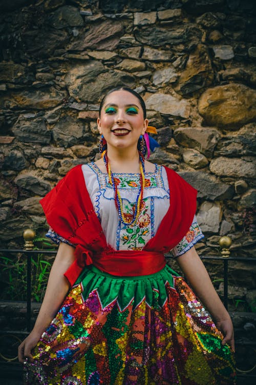Free A woman in mexican dress posing for a photo Stock Photo