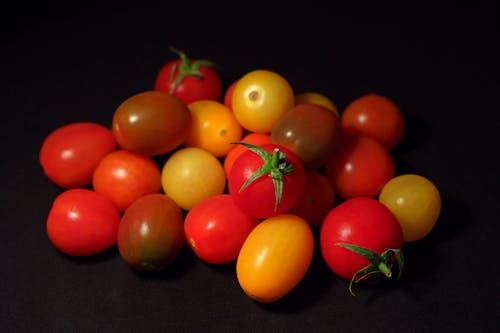 Orange and Yellow Tomato on Black Textile