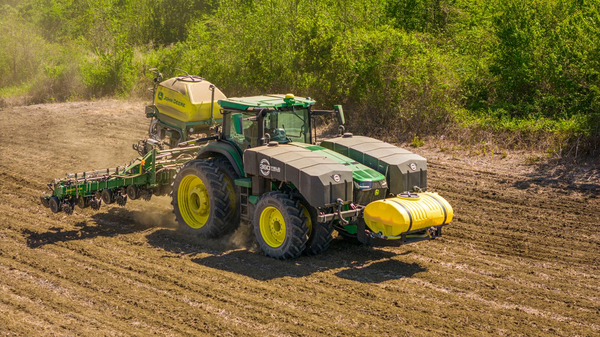 A Tractor with a Seeder on a Cropland