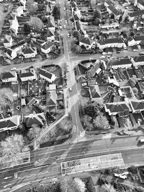 An aerial view of a town with houses and roads