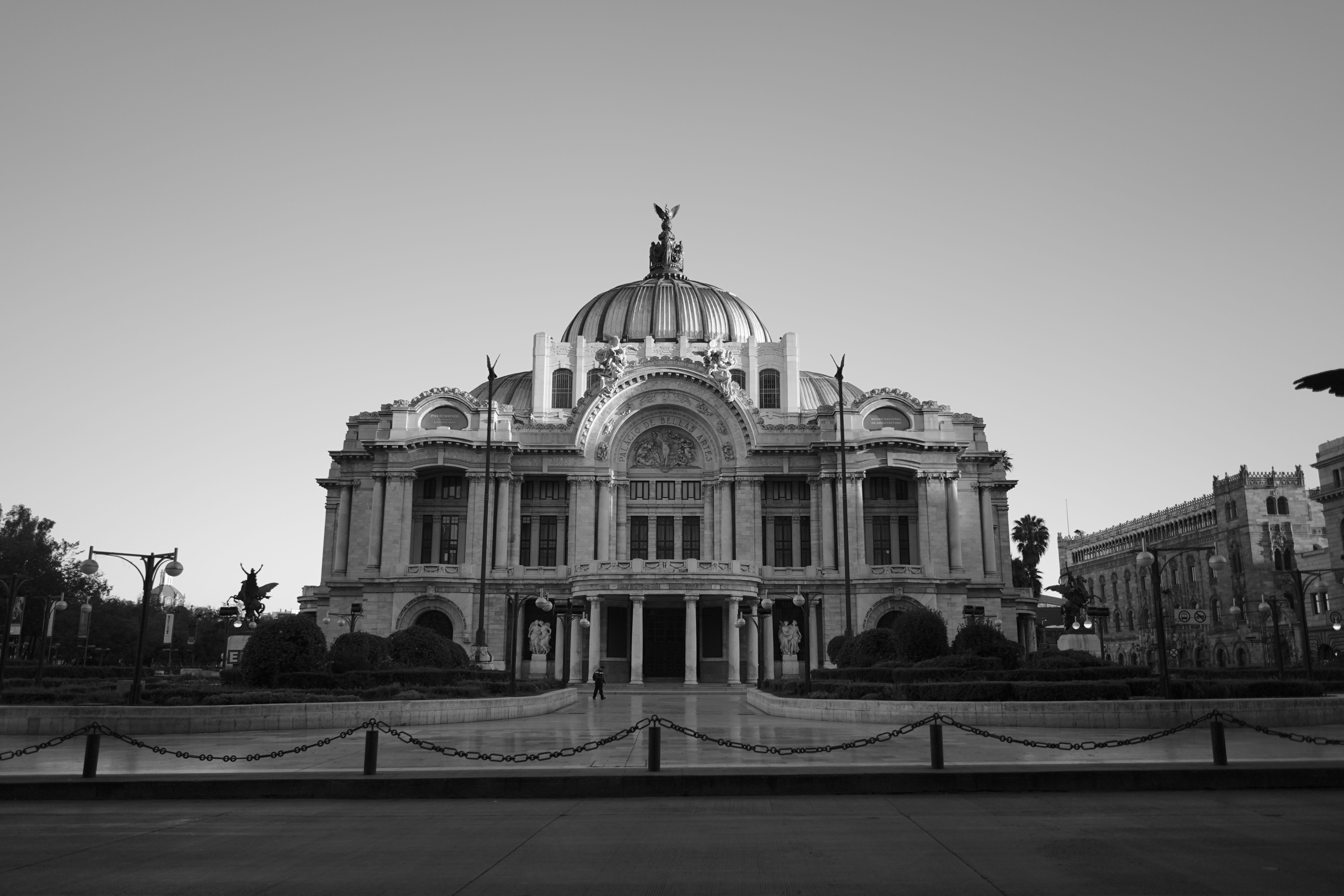 Black and white photo of Palacio de Bellas Artes, an iconic landmark in Mexico City.