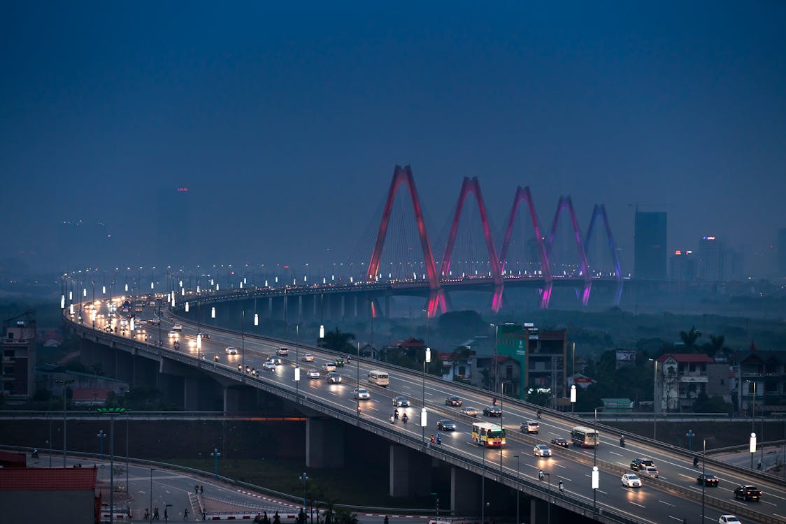 Vehicles on Gray Concrete Bridge