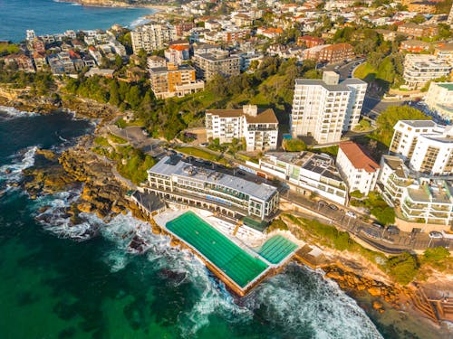 Aerial View of Hotel with Pool on Rocky Coastline