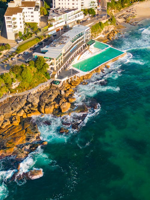 An aerial view of a beach and hotel